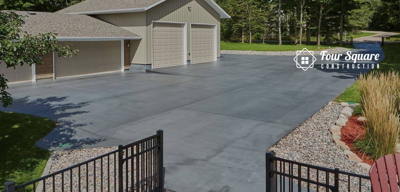 how thick should a concrete driveway be
