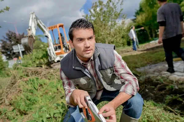how to build a 3 rail wood fence a person measuring with tape