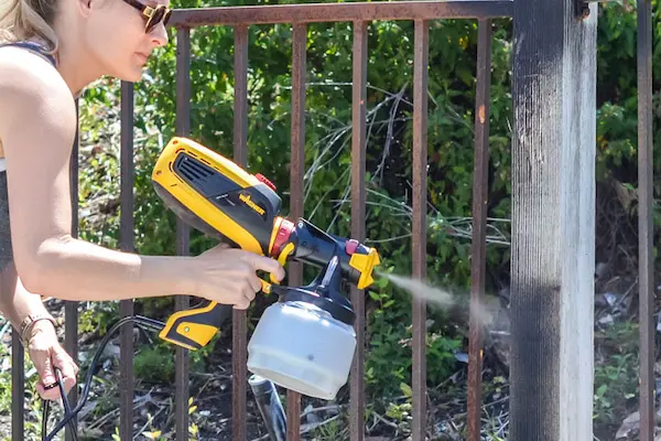 How To Paint A Metal Fence Applying the Paint