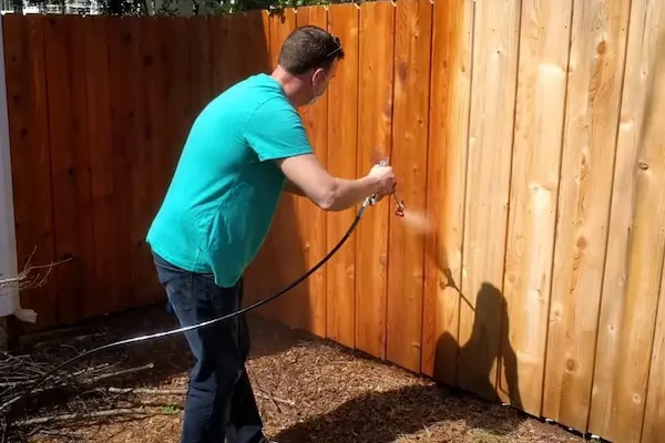 Applying Stain On Fence