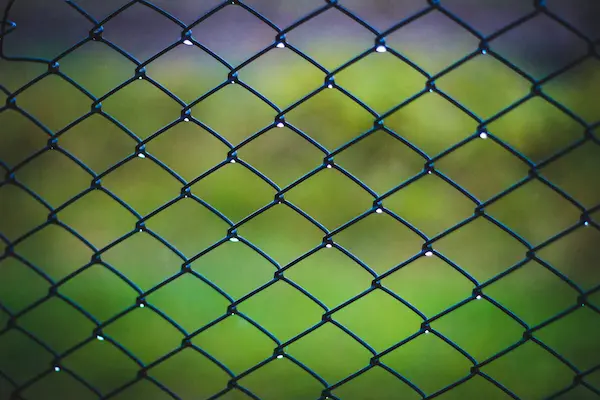 spray paint for chain link fence Chain link fence in rain