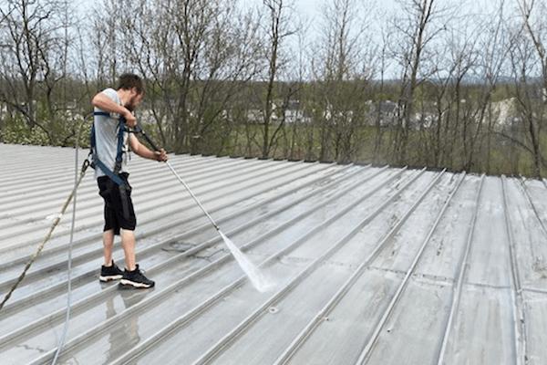 Applying primer to the roof